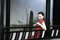 Chinese cheongsam model in Chinese classical garden